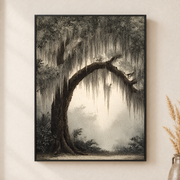 Framed canvas wall art depicting a dramatic curved tree trunk with hanging moss framing a pale foggy path on a neutral wall