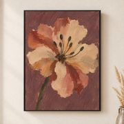 Framed canvas wall art depicting a single cream and peach blossom with dark stamens against a dusty mauve background on a neutral wall