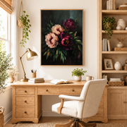Framed burgundy peony canvas art displayed above a wooden desk in a home office