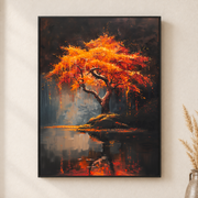 Framed canvas wall art depicting a brilliant fiery orange tree reflected in still lake water at dusk on a neutral wall