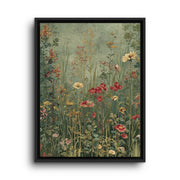 Black floating frame canvas depicting tiny red, cream, and gold meadow flowers scattered across a sage green field