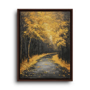 Brown floating frame canvas depicting a winding woodland road covered in golden leaves beneath tall autumn trees