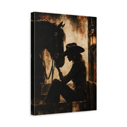 Unframed gallery wrapped canvas depicting a cowgirl in a wide-brimmed hat resting her forehead against a dark horse